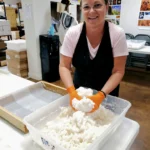 Instructor making a candy board during the Deseret Hive Supply Candy Board Workshop.